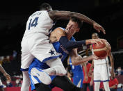 Czech Republic's Jan Vesely (24) is defended and fouled by United States's Draymond Green (14) during a men's basketball preliminary round game at the 2020 Summer Olympics, Saturday, July 31, 2021, in Saitama, Japan. (AP Photo/Eric Gay)