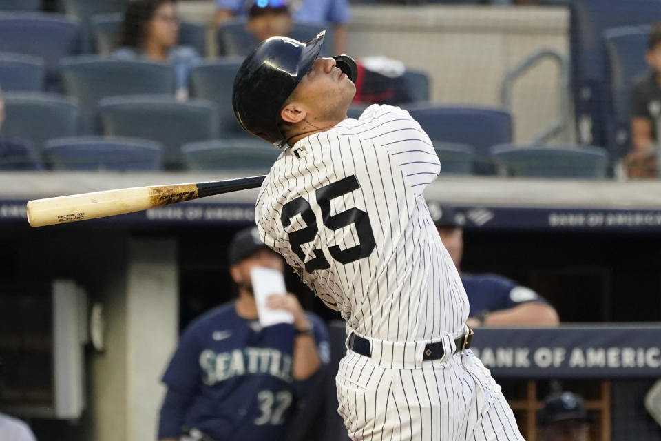New York Yankees' Gleyber Torres watches his sacrifice fly in the second inning of the team's baseball game against the Seattle Mariners, Thursday, Aug. 5, 2021, in New York. (AP Photo/Mary Altaffer)
