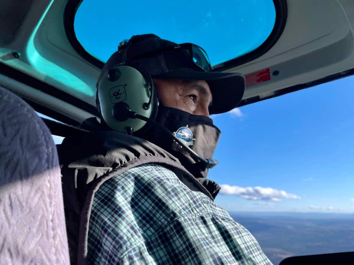 Blueberry River First Nations Chief Marvin Yahey flies over the traditional territory of the nation in northeastern B.C. earlier this month. (Kyle Bakx, CBC - image credit)