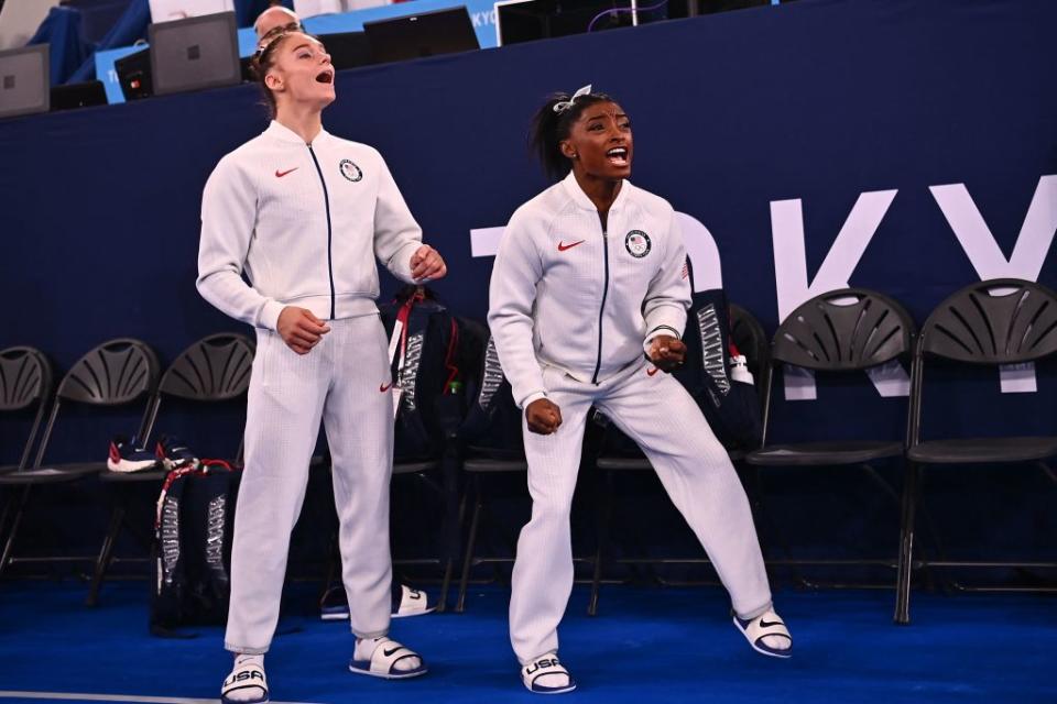 Team USA's Grace Mc Callum and USA's Simone Biles react during the artistic gymnastics women's team final during the Tokyo 2020 Olympic Games at the Ariake Gymnastics Centre in Tokyo on July 27, 2021.<span class="copyright">Loic Venance—AFP via Getty Images</span>