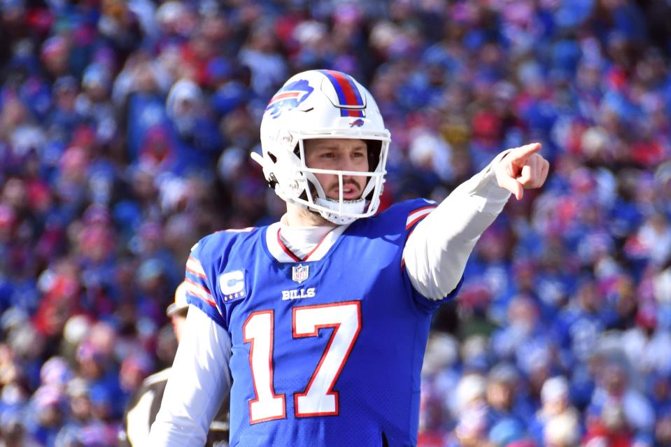 Buffalo Bills quarterback Josh Allen (17) before a snap against the Miami Dolphins during the first half in a NFL wild card game at Highmark Stadium.