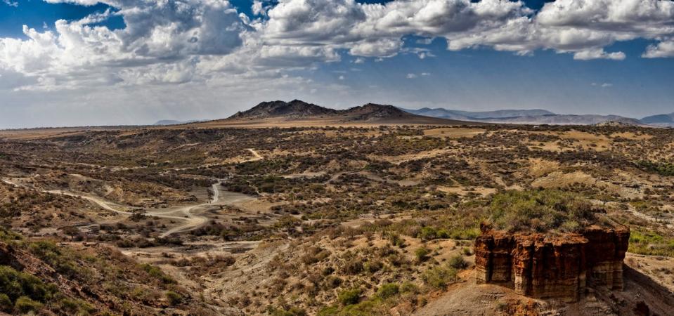 Tanzania's Olduvai Gorge, world-famous for its Stone Age archaeology, is one of the likely places where people first started talking (Creative Commons)