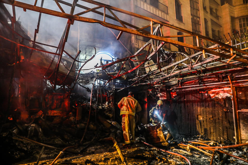 First responders search for survivors at the scene of an explosion at the Sina At'har health centre in the north of Iran's capital Tehran northern Tehran on June 30, 2020.(Amir Kholousi/ISNA/AFP via Getty Images)