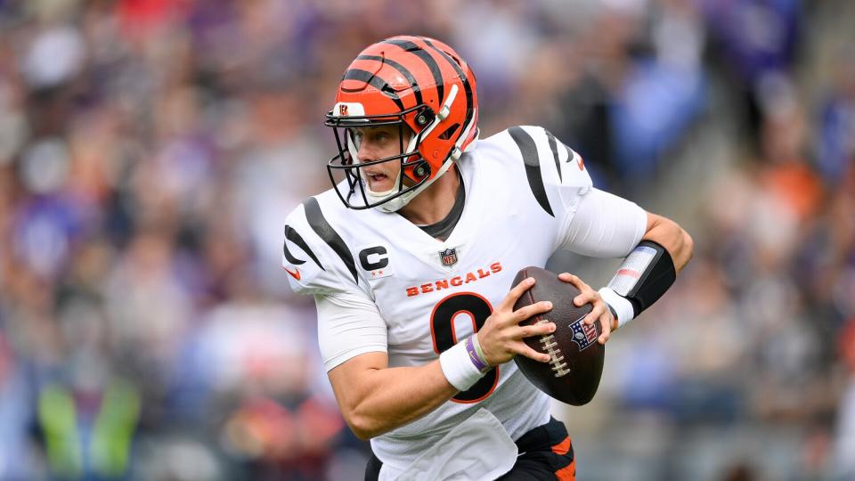 Cincinnati Bengals quarterback Joe Burrow rolls out to pass against the Baltimore Ravens.