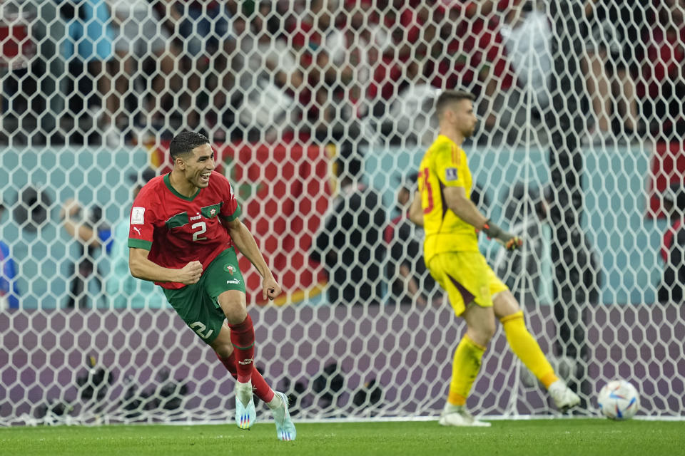 Morocco's Achraf Hakimi celebrates after scoring the wining penalty during the penalties shootouts World Cup round of 16 soccer match between Morocco and Spain, at the Education City Stadium in Al Rayyan, Qatar, Tuesday, Dec. 6, 2022. (AP Photo/Ebrahim Noroozi)