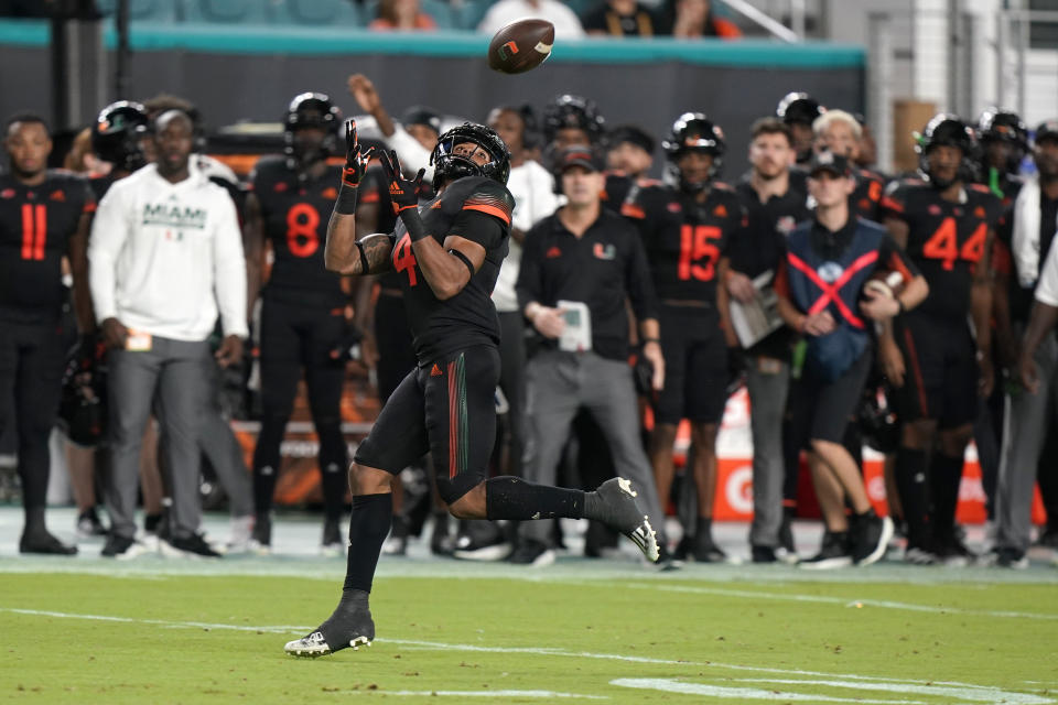 Miami running back Jaylan Knighton catches a touchdown pass during the first half of the team's NCAA college football game against North Carolina State, Saturday, Oct. 23, 2021, in Miami Gardens, Fla. (AP Photo/Wilfredo Lee)