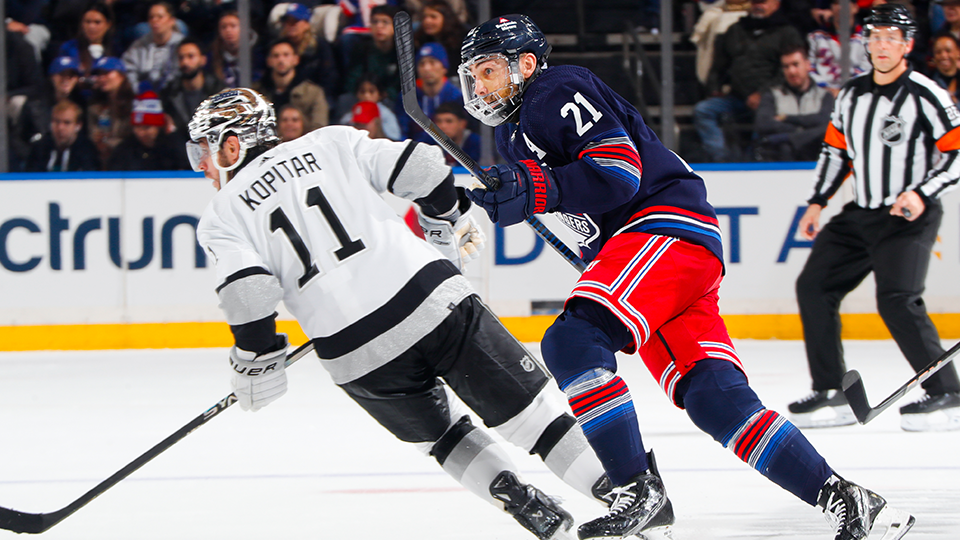 Barclay Goodrow #21 of the New York Rangers skates against Anze Kopitar #11 of the Los Angeles Kings at Madison Square Garden on December 10, 2023 in New York City.