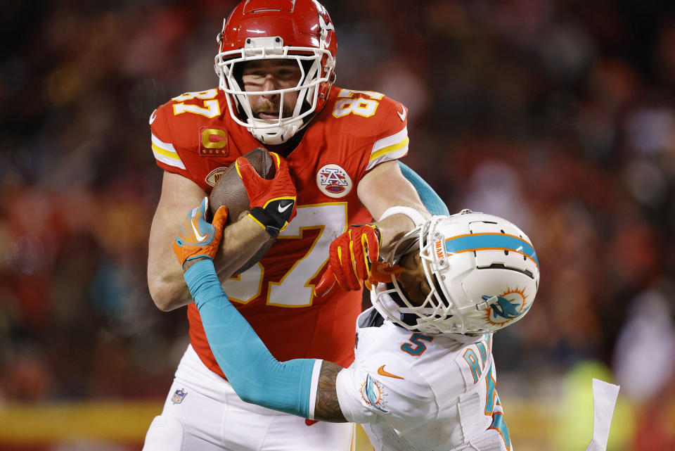 Travis Kelce #87 of the Kansas City Chiefs stiff arms Jalen Ramsey #5 of the Miami Dolphins during the third quarter in the AFC Wild Card Playoffs at GEHA Field at Arrowhead Stadium on January 13, 2024 in Kansas City, Missouri.  (David Eulitt / Getty Images)