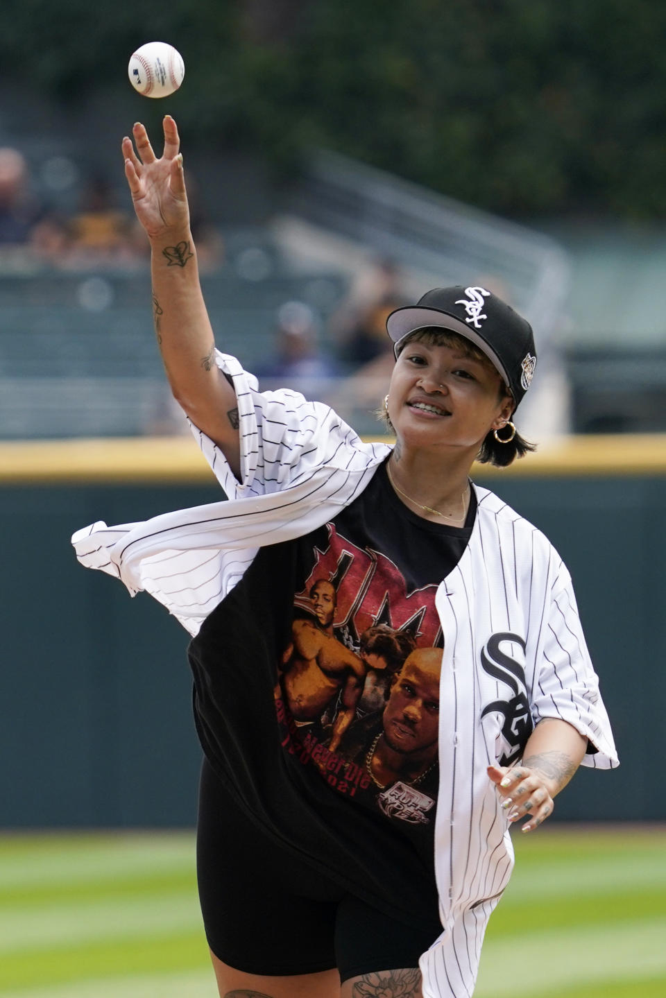 Singer King Marie throws out a ceremonial first pitch before a baseball game between the Cleveland Guardians and the Chicago White Sox in Chicago, Sunday, July 24, 2022. (AP Photo/Nam Y. Huh)