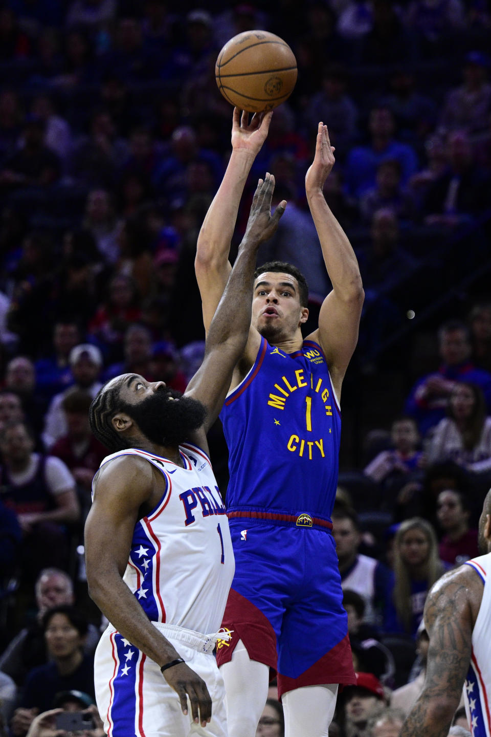 Denver Nuggets' Michael Porter Jr., right, shoot over Philadelphia 76ers' James Harden during the first half of an NBA basketball game, Saturday, Jan. 28, 2023, in Philadelphia. (AP Photo/Derik Hamilton)