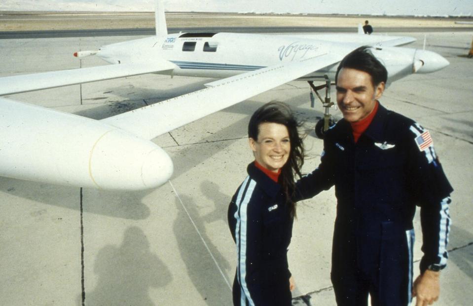 Dick Rutan and Jeana Yeager pose by their Voyager aircraft.