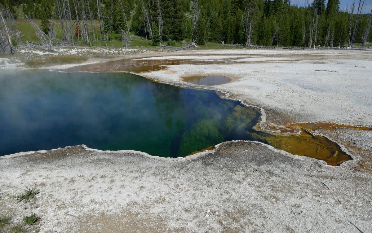 FILE - In this photo provided by the National Park Service is the Abyss Pool hot spring in the southern part of Yellowstone National Park, Wyo., in June 2015.  (AP)