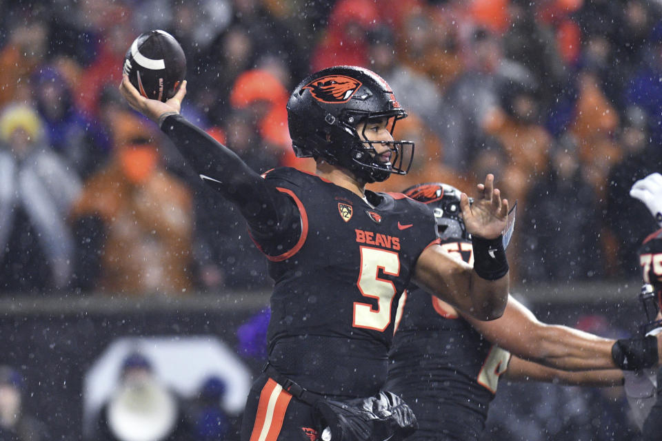 Oregon State quarterback DJ Uiagalelei (5) looks to throw a pass against Washington during the first half of an NCAA college football game Saturday, Nov. 18, 2023, in Corvallis, Ore. (AP Photo/Mark Ylen)