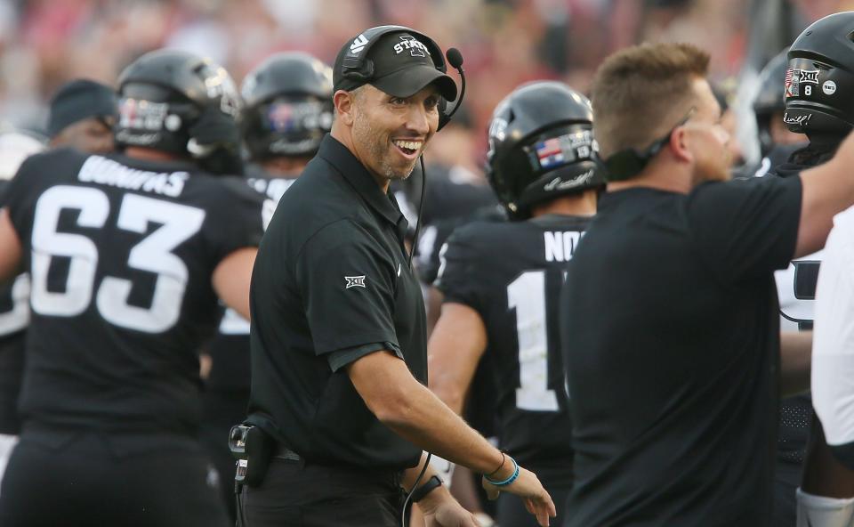 Iowa State Cyclones head coach Matt Campbell celebrates with the team after a touchdown during the third quarter of an NCAA college football game against Oklahoma State Cowboys at Jack Trice Stadium on Saturday, Sept. 23, 2023, in Ames, Iowa