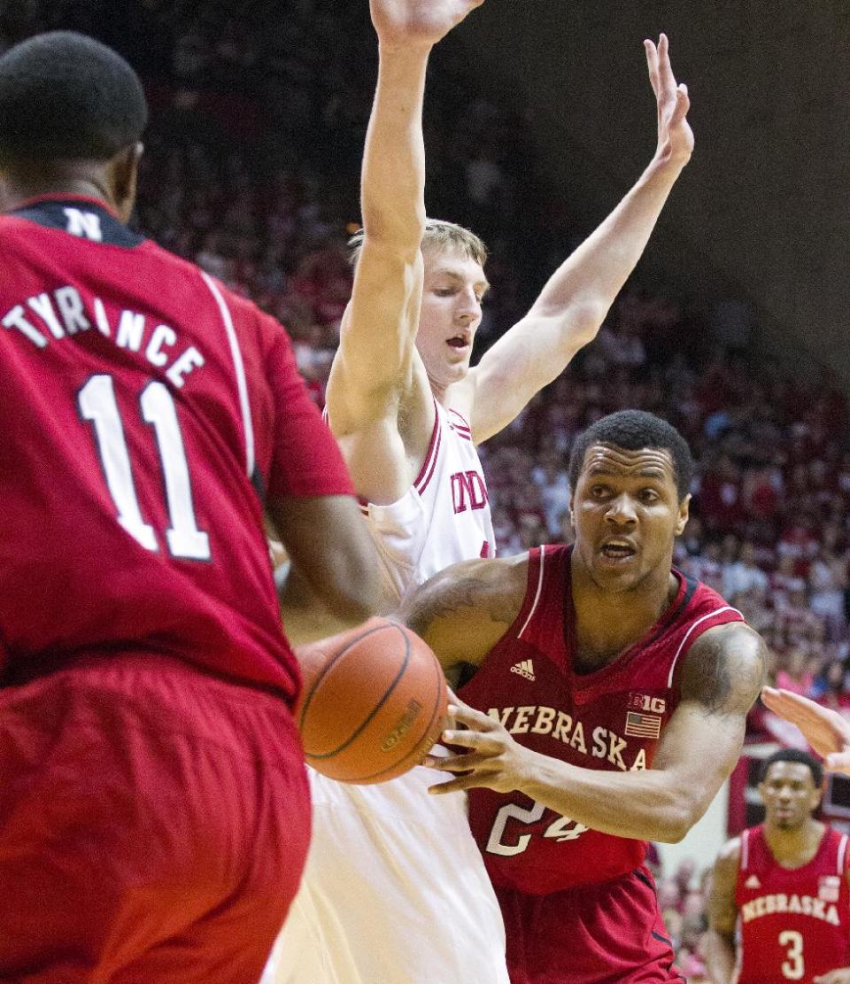 Nebraska's Dylan Talley (24) makes a pass to Jordan Tyrance (11) as Indiana's Will Sheehey (0) defends during the first half of an NCAA college basketball game, Wednesday, Feb. 13, 2013, in Bloomington, Ind. (AP Photo/Doug McSchooler)