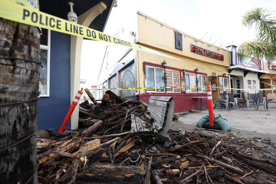 Debris is seen piled up in front of a restaurant following a massive storm that hit the area on Jan. 6, 2023, in Capitola, California.  / Credit: Getty Images