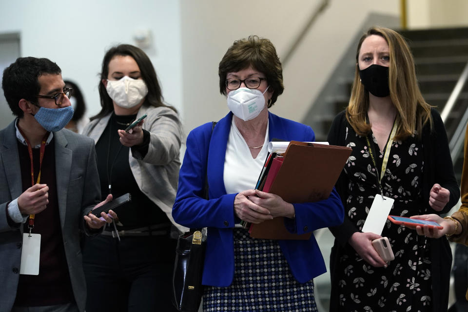 Sen. Susan Collins, R-Maine, is followed by reporters as she walks on Capitol Hill in Washington, Thursday, Feb. 11, 2021, after the third day of the second impeachment trial of former President Donald Trump. (AP Photo/Susan Walsh)