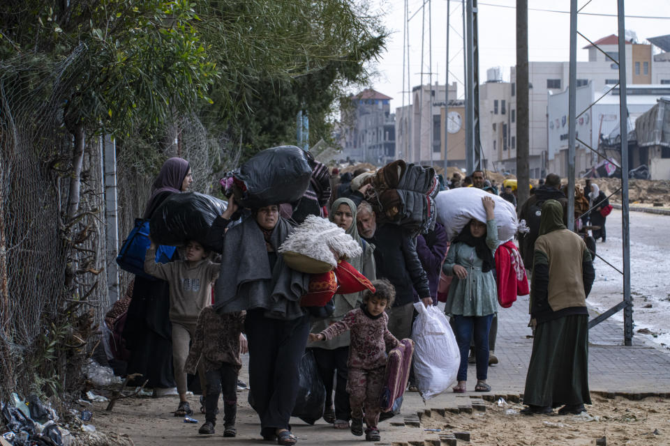 Palestinians flee from the city of Khan Younis in southern Gaza during Israeli ground and air offensive on Monday, Jan. 29, 2024. (AP Photo/Fatima Shbair)