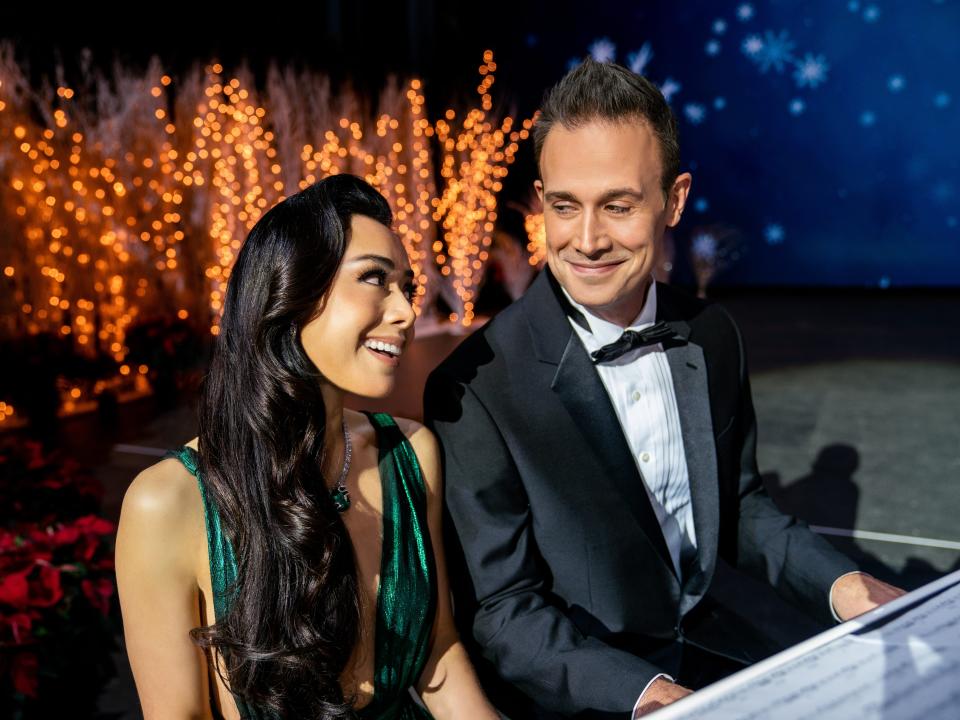 angelina and miguel performing at a piano in christmas with you netflix movie