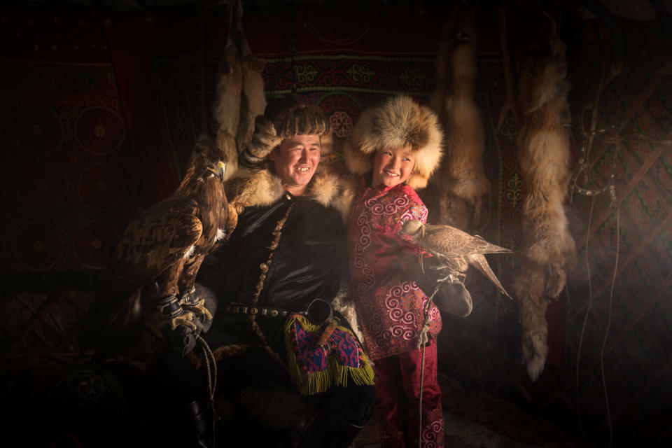 <p>Daniel, from Moscow, learned that the hunters train eagles from an early age and look after the majestic birds until they are 12 years of age. (Photo: Daniel Kordan/Caters News) </p>