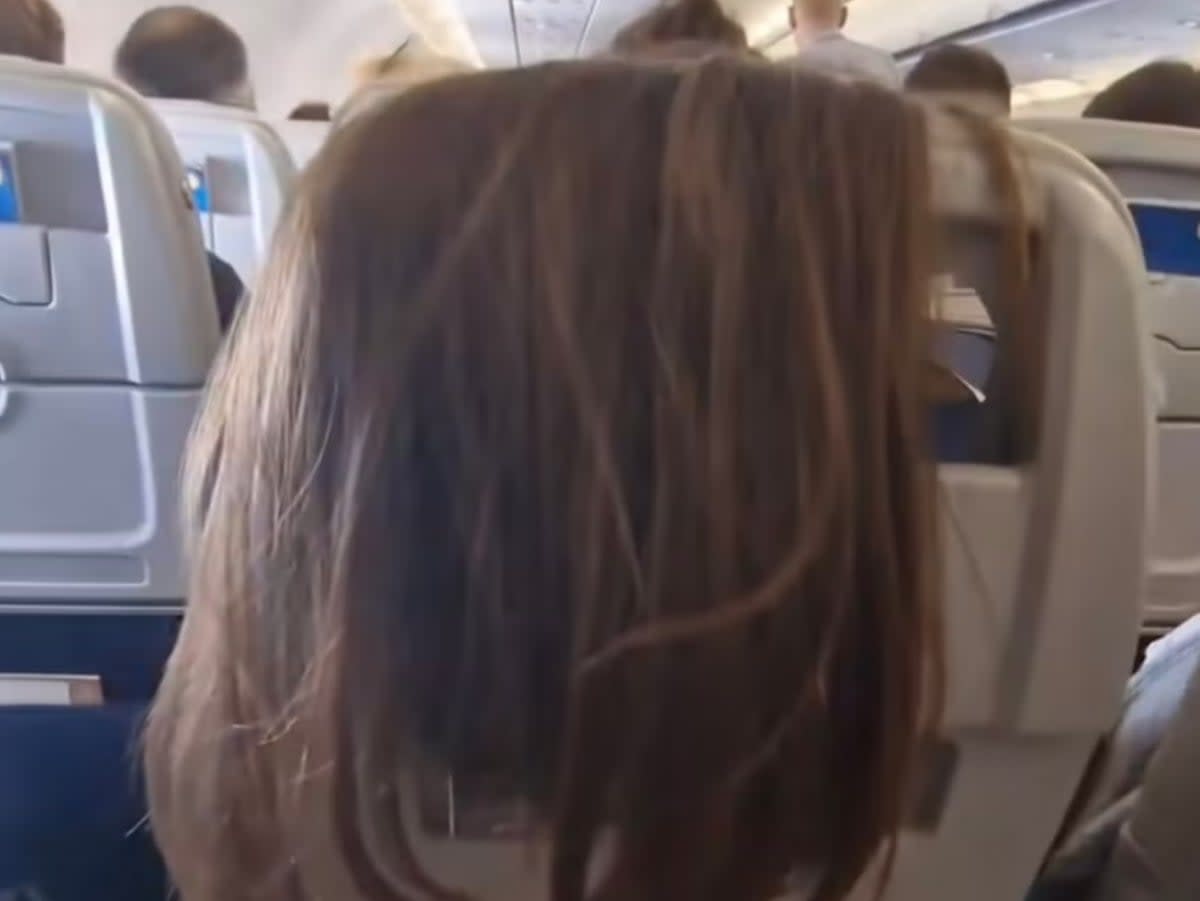 Hair today, gone tomorrow? Watch your locks on a flight (@julie.b.christensen/TikTok)