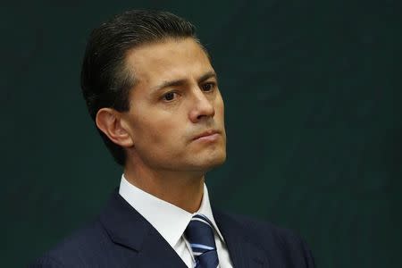 Mexico's President Enrique Pena Nieto looks on during the oath ceremony for new Secretary of the Public Administration Virgilio Andrade Martinez at Los Pinos Presidential house in Mexico City, in this February 3, 2015 file picture. Mexican President Enrique Pena Nieto misrepresented to authorities the circumstances under which he acquired one of his properties, public documents reviewed by Reuters show, a discrepancy that could add to the controversy surrounding his personal finances. REUTERS/Edgard Garrido/Files