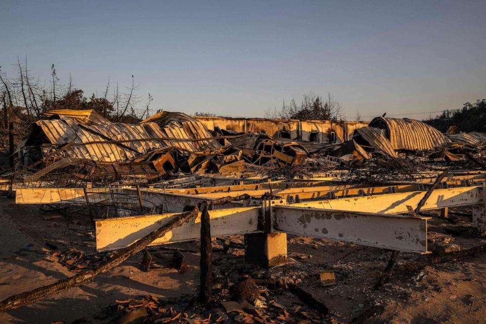 PHOTO: A beach bars destroyed by wildfires lies crumples at the beach of Glystra, along the coast from Kiotari on the Greek island of Rhodes, on July 25, 2023. (Angelos Tzortzinis/AFP via Getty Images)