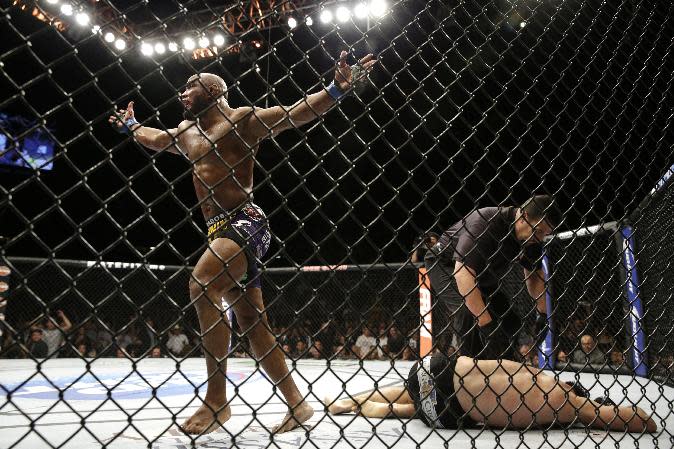 Yoel Romero celebrates after his fight with Tim Kennedy, Saturday, Sept. 27, 2014, in Las Vegas. Romero won via TKO. (AP Photo/John Locher)