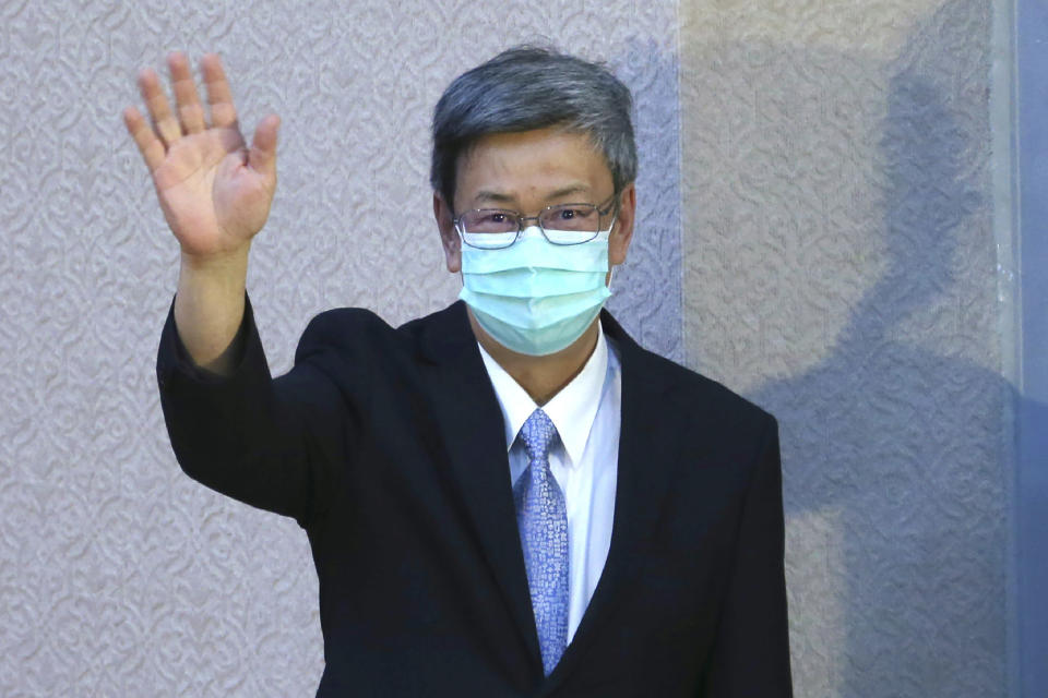 FILE - Taiwan former Vice President Chen Chien-jen, waves as he meets U.S. Health and Human Services Secretary Alex Azar, at National Taiwan University College of Public Health in Taipei, Taiwan on Aug. 11, 2020. The attendance of both the former bishop of Hong Kong and an advisor to Taiwan's leader at this week's funeral for Pope Emeritus Benedict XVI highlights the Vatican's uneasy relationship with communist-ruled China.(AP Photo/Chiang Ying-ying, File)