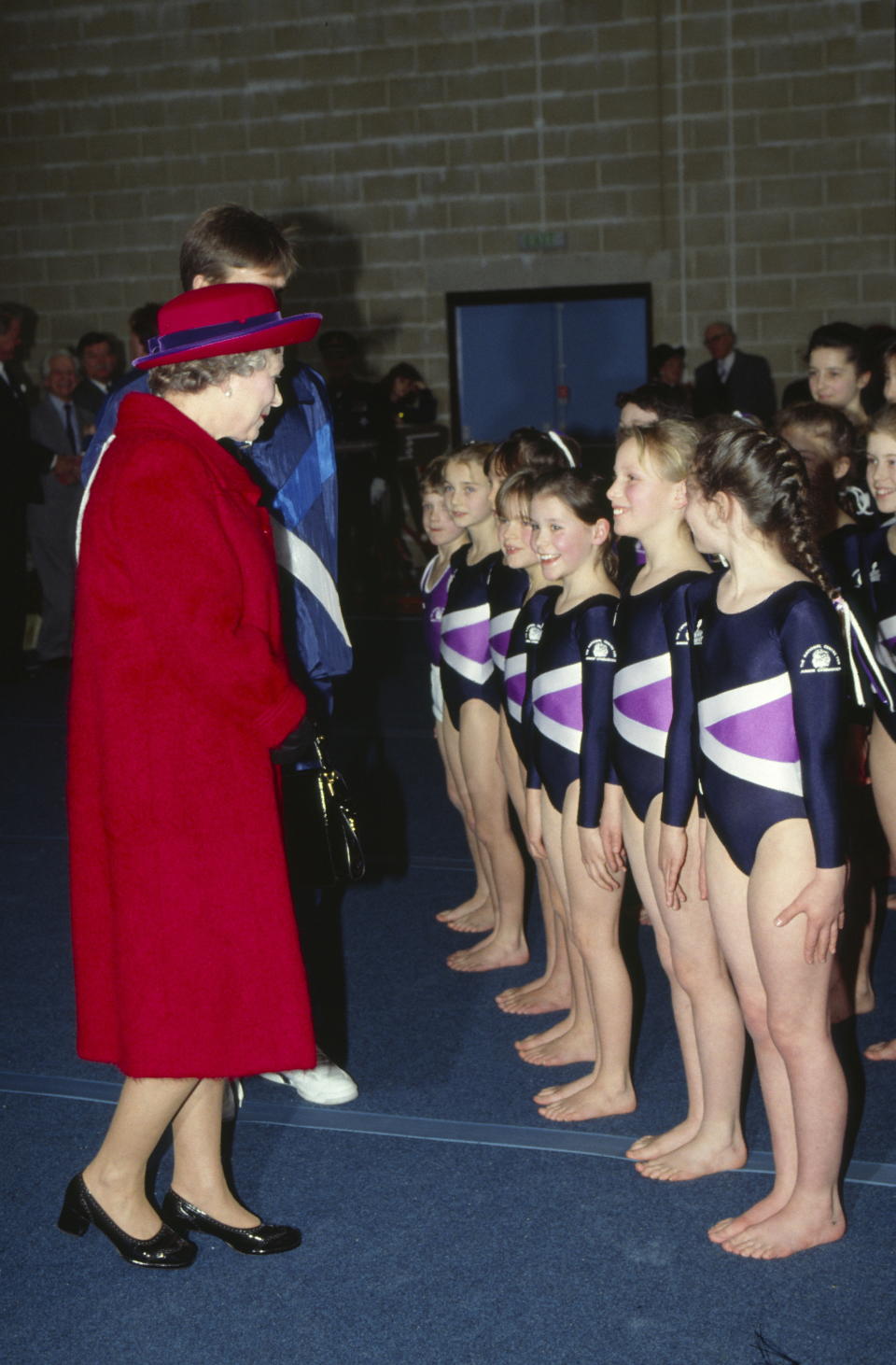 PORT REGIS, UNITED KINGDOM - FEBRUARY 23:  The Queen Visiting Port Regis School Where Their Grandchildren Zara And Peter Phillips Are Pupils. The Queen Is Talking To Zara Who Is Doing A Gymnastics Display.  (Photo by Tim Graham Photo Library via Getty Images)
