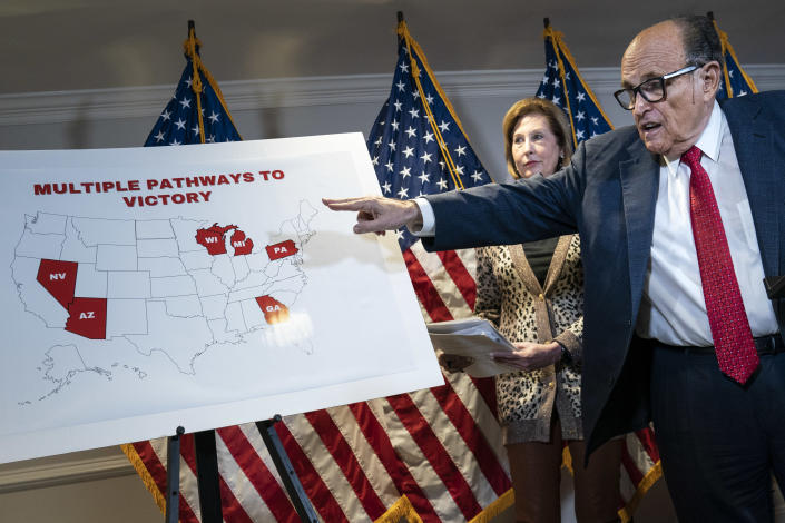 Rudy Giuliani points to a map as he speaks to the press about various lawsuits related to the 2020 election,  inside the Republican National Committee headquarters on November 19, 2020 in Washington, DC. (Drew Angerer/Getty Images)