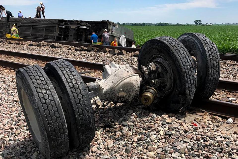 In this photo provided by Dax McDonald, debris sits near railroad tracks after an Amtrak passenger train derailed near Mendon, Mo., on Monday, June 27, 2022. The Southwest Chief, traveling from Los Angeles to Chicago, was carrying about 243 passengers when it collided with a dump truck near Mendon, Amtrak spokeswoman Kimberly Woods said.