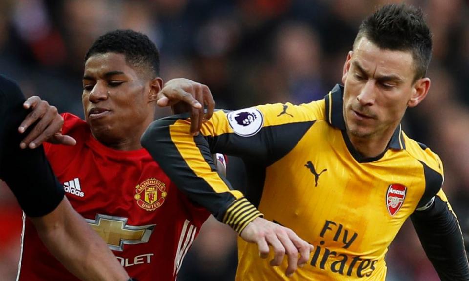 Manchester United’s Marcus Rashford and Arsenal’s Laurent Koscielny collide during the team’s meeting at Old Trafford earlier this season.