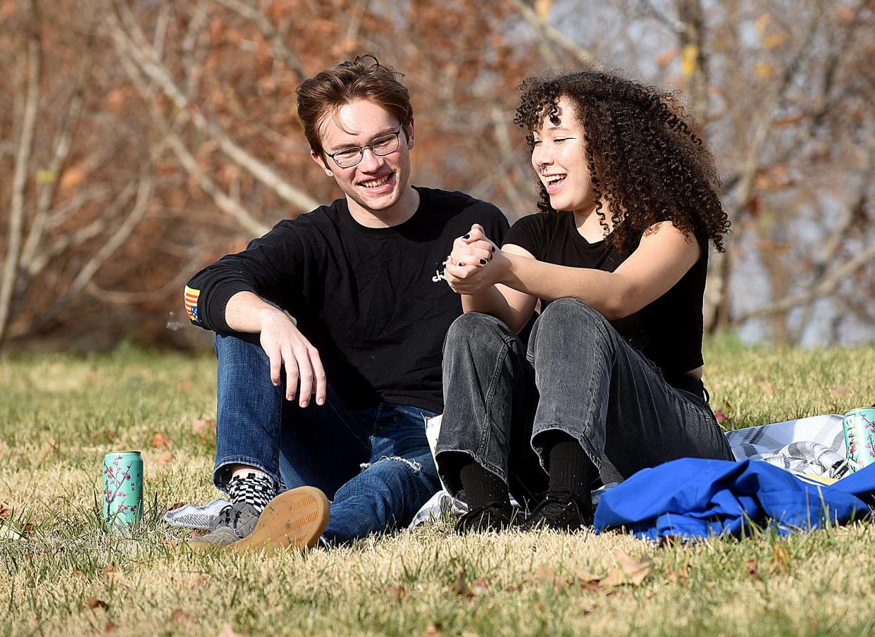 Alex Troxell and Jada Otiker, both of Columbia, enjoy the warm weather Tuesday with a picnic at Stephens Lake Park. Temperatures reached 68 degrees in Columbia on Tuesday and are expected to reach around 74 degrees on Wednesday.