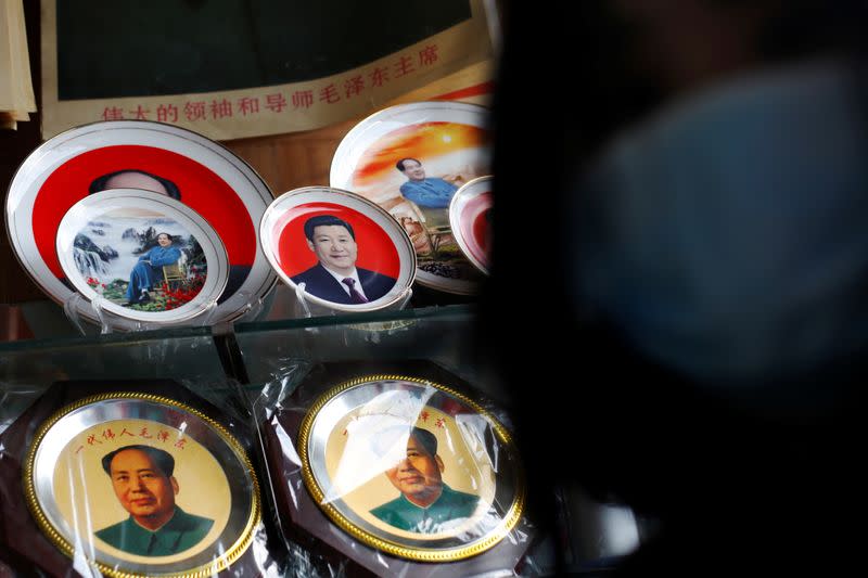 Souvenir plates featuring portraits of Chinese President Xi Jinping and late Chairman Mao Zedong are seen displayed at a shop in Beijing