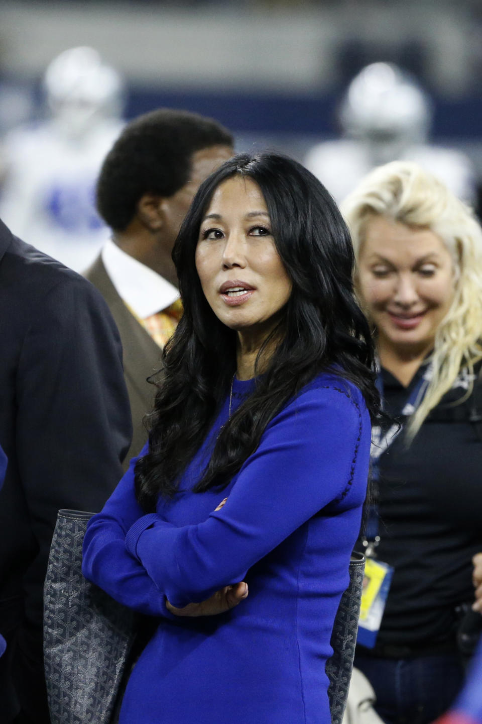 FILE - Buffalo Bills co-owner Kim Pegula looks on during warmups before an NFL football game against the Dallas Cowboys in Arlington, Texas, Thursday, Nov. 28, 2019. Buffalo Bills and Sabres co-owner Kim Pegula is receiving medical care from what her family on Tuesday, June 14, 2022, described as being “some unexpected health issues.” (AP Photo/Michael Ainsworth, File)