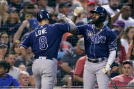 Tampa Bay Rays' Brandon Lowe (8) is congratulated by Randy Arozarena after his solo home run off Boston Red Sox starting pitcher Eduardo Rodriguez during the third inning of a baseball game at Fenway Park, Tuesday, Aug. 10, 2021, in Boston. (AP Photo/Charles Krupa)