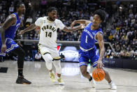 New Orleans guard Jordan Johnson (1) drives on Purdue guard David Jenkins Jr. (14) during the first half of an NCAA college basketball game in West Lafayette, Ind., Wednesday, Dec. 21, 2022. (AP Photo/Michael Conroy)
