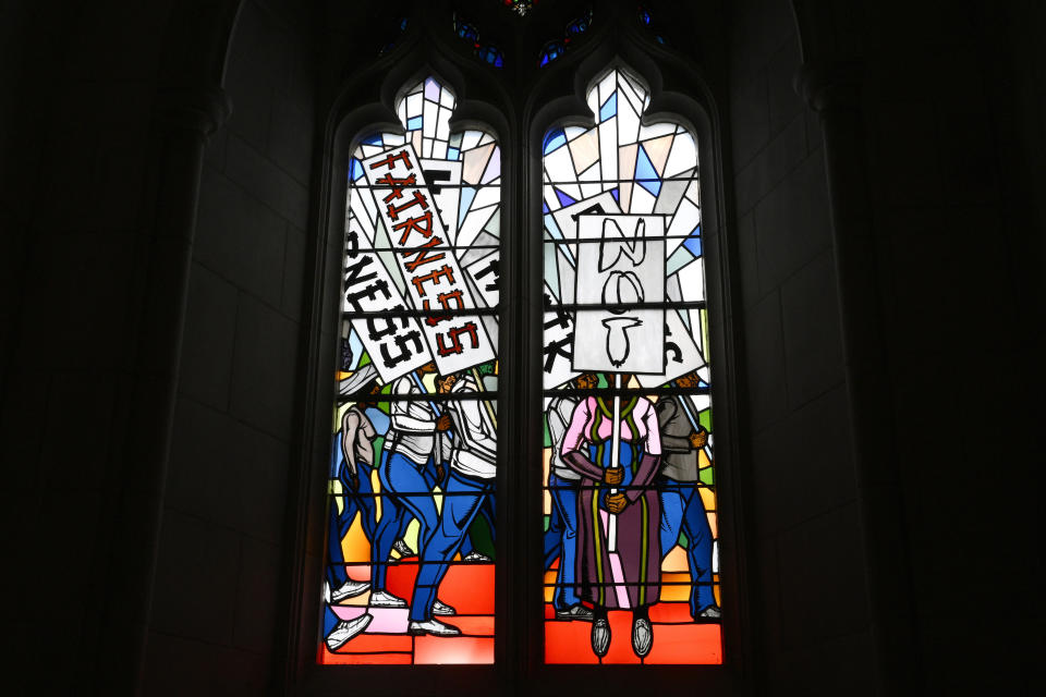 Light shines through new stained-glass windows with a theme of racial justice during an unveiling and dedication ceremony at the Washington National Cathedral for the windows on Saturday, Sept. 23, 2023, in Washington. The windows fill the space that had once held windows honoring Confederate Gens. Robert E. Lee and Stonewall Jackson. The new windows depict a march for justice by African Americans. (AP Photo/Nick Wass)