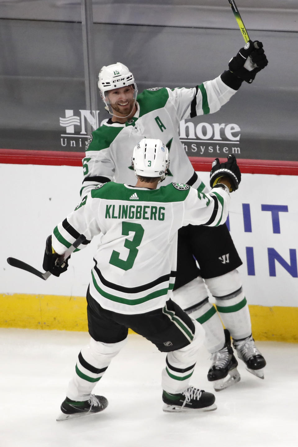 Dallas Stars left wing Blake Comeau (15) celebrates his goal with John Klingberg (3) during the second period of the team's NHL hockey game against the Chicago Blackhawks on Thursday, April 8, 2021, in Chicago. (AP Photo/Jeff Haynes)