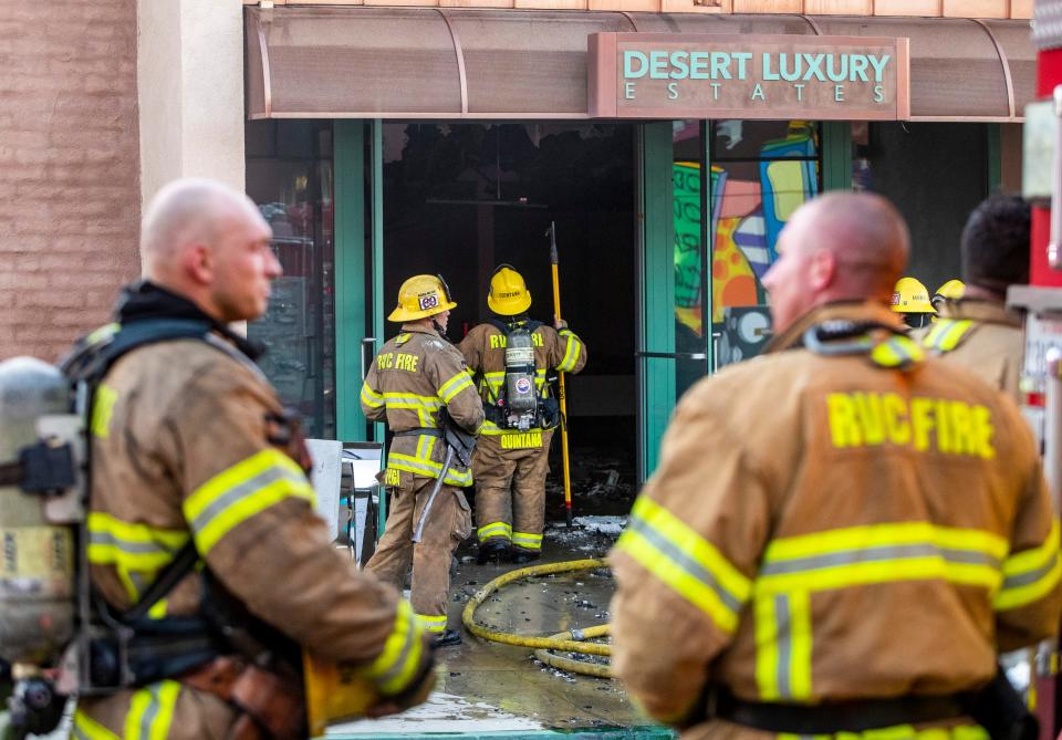 Fire crews from multiple agencies respond to a fire at a commercial building at 73-350 El Paseo in Palm Desert, Calif., Tuesday, Nov. 15, 2022. The fire was reported at 3:04 p.m. at the second story of Desert Luxury Estates, a vacation home rental agency office. CalFire said there were no reported injuries and the fire was contained at 4:30 p.m. 
