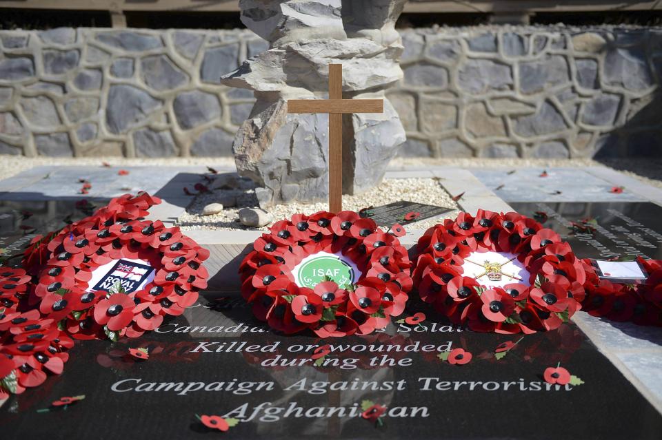 Wreaths are seen laid on Armistice Day at the memorial in Kandahar Airfield, Afghanistan