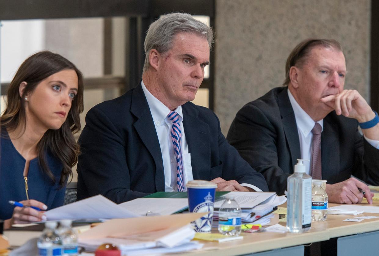 In a 2022 file photo, Worcester District Attorney Joseph D. Early Jr., center, listens to testimony during a state Ethics Commission hearing. At left is his lawyer, Meredith Fierro, and at right is Timothy Burke, lawyer for former state police Maj. Susan Anderson.