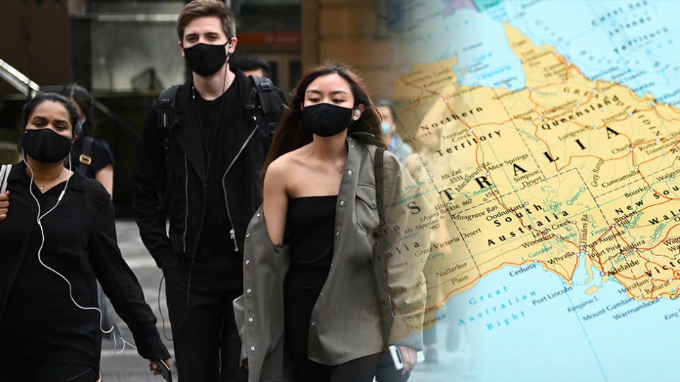 Jobs: People walk on a city street in Australia wearing masks and a map of Australia.