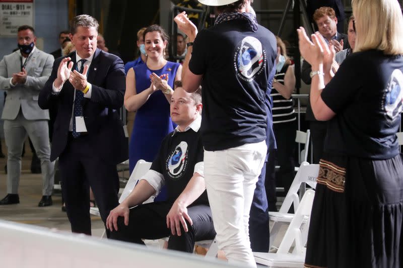 Musk receives a standing ovation during remarks after the launch of a SpaceX Falcon 9 rocket and Crew Dragon spacecraft from NASA's Kennedy Space Center in Cape Canaveral, Florida