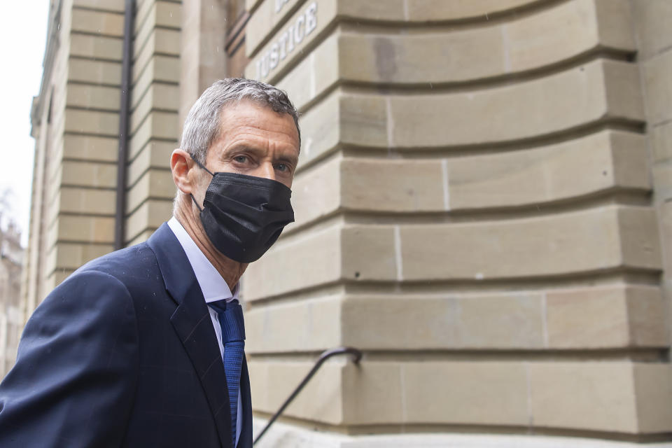 Israeli businessman and diamond-magnate, Beny Steinmetz, arrives to Geneva's courthouse for the reading of his verdict for alleged corruption of Guinean public officials and forgery documents, in Geneva, Switzerland, Friday, Jan. 22, 2021. (Martial Trezzini/Keystone via AP)