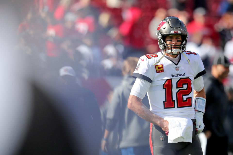 Tampa Bay Buccaneers quarterback Tom Brady (12) relaxes during warmup of a NFL divisional playoff football game between the Los Angeles Rams and Tampa Bay Buccaneers, Sunday, January 23, 2022 in Tampa, Fla. (AP Photo/Alex Menendez)