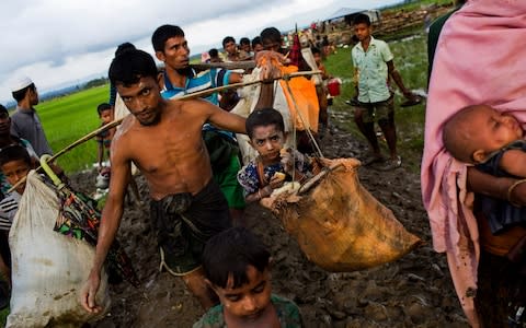 Myanmar's military says almost 400 people have died in recent violence in the western state of Rakhine - Credit: AP Photo/Bernat Armangue