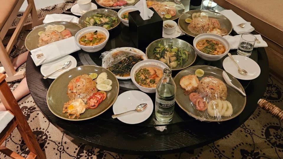 Uneaten meals are left on a table in a suite at Bangkok's Grand Hyatt Erawan Hotel, where six people were found dead on July 16, 2024. - Royal Thai Police/AP