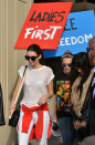 <p>The duo were spotted leaving the Chanel show holding up placards reading: 'Ladies First' and 'Free Freedom', which was perhaps a nod for women's equality. Preach sisters.</p>